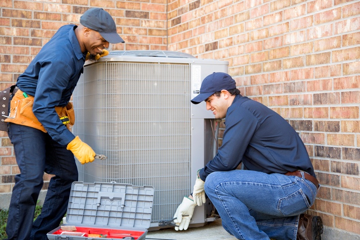 Air Conditioner Repairmen at Work.